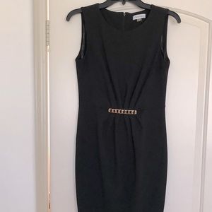 Calvin Klein elegant black dress with gold clasp